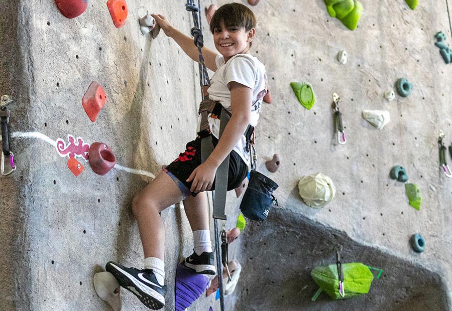 Kid on the HHPC Rock Climbing wall at SJC during Kids Kollege